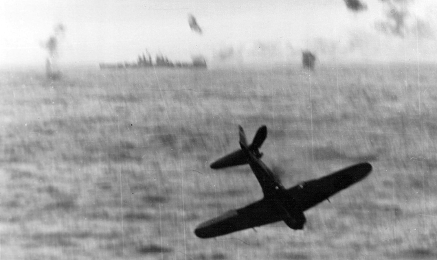 An A6M Zero crashes into the sea after an unsuccessful attempt to strike the USS Essex (CV-9) during the Battle of Okinawa in May 1945 (US Navy)